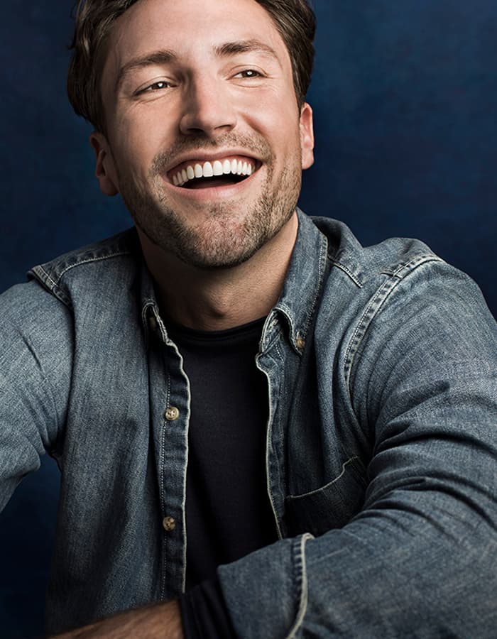 Adult male smiling after orthodontic treatment